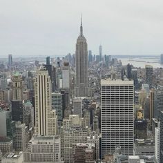 an aerial view of the city with skyscrapers and other tall buildings in the foreground