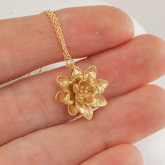 "This lotus flower pendant makes for such a sweet and feminine necklace. The details on the lotus are so delicate and timeless, and it's just such a cute size. I love the little capillaries visible in the petals and the little sprigs in the center of the flower. The details really are just perfect and so very dainty. I've kept everything as minimal as possible, and made the option of adding some stellar amethyst cushion cut dangles if you want some sparkle to go with the slightly matte flower. R Luxury Traditional Flower Pendant Jewelry, Cheap Elegant Flower Pendant Jewelry, Cheap Elegant Flower Pendant Necklace, Affordable Bohemian Flower Pendant Necklace, Affordable Gold Adjustable Flower Necklace, Cheap Gold Charm Necklace With Flower Pendant, Luxury Flower Pendant Necklace As Gift, Luxury Flower-shaped Necklace For Gift, Luxury Gold Flower Pendant Necklace