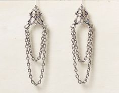 These delicate earrings are made from ornate antique silver filigree and 2 sets of chains. They will make a beautiful accessory for someone who loves the Gothic Victorian aesthetic. -The earrings are 2.75 inches long, without the lever back closure -They have a lever back closure SHIPPING: Default shipping is by regular mail, which does not have tracking, shipping times are as follows: US: 1-3 weeks Canada: 1-2 weeks Europe: 2-4 weeks If you would like to add tracking for your parcel, please upg Elegant Oxidized Chandelier Earrings For Weddings, Ornate Dangle Chandelier Earrings For Formal Occasion, Formal Ornate Dangle Chandelier Earrings, Elegant Silver Chandelier Earrings With Oxidized Finish, Victorian Chandelier Dangle Earrings With Intricate Design, Victorian Chandelier Earrings With Intricate Design, Classic Filigree Dangle Chandelier Earrings, Classic Filigree Chandelier Dangle Earrings, Classic Filigree Chandelier Earrings