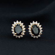 Product Details Make your Anniversary a memorable occasion for her by giving her a heartwarming present like these Statement Earrings. These Stud Earrings are embellished with Oval Cut Black Onyx Set in Prong Setting with Diamond Halo, crafted in Gold. Product Information SKU SHP-EARRINGS0621106690 Length 10.3 mm Width 8.3 mm Weight 2.31 gm (Approximate) BLACK ONYX INFORMATION No.of Stones 2 Pieces Total Weight 2.20 Carat (Approximate) Dimension(approx) Oval-6X8 mm-2 Pcs Color Black Cut Brillian Halo 2, Halo Earrings, Onyx Earrings, Onyx Gemstone, Signature Jewelry, Diamond Halo, Halo Diamond, Jewelry Earrings Studs, Oval Cut