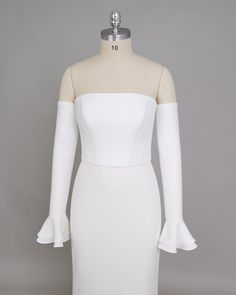 a white dress on a mannequin head