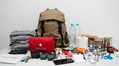 the contents of a backpack laid out on a table