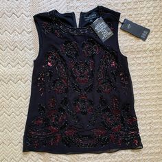 Hand Embroidered Blouse. Pristine Condition. Black Embroidered Silk Top, Elegant Embroidered Tops For Night Out, Festive Embroidered Evening Tops, Festive Embellished Chic Tops, Silk Embroidered Evening Tops, Chic Embroidered Festive Tops, Embroidered Sleeveless Evening Blouse, Sleeveless Embroidered Evening Blouse, Festive Sleeveless Holiday Top