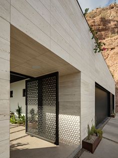 an entrance to a modern home in the desert