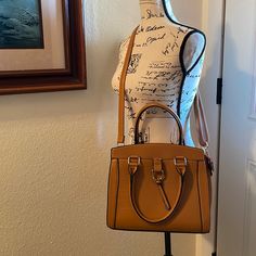 Nwot-Beautiful Camel Colored Purse With Gold Accents. Hardbody (Which Why I Am Selling, Too Heavy For Me). The Front Has A Snap Closure Pocket. The Back Has A Zippered Pocket. The Inside Has A Zippered Pocket And 1 Large Pocket. The Inside Has Belt And Tassel Design. The Long Shoulder Strap Is Adjustable And Removable And It Has 2 Handles. Snake Pattern Faux Leather. See Pictures For Measurements. Snake Pattern, Snake Patterns, Gold Orange, Camel Color, Orange Gold, Shoulder Purse, Gold Accents, Snap Closure, Camel