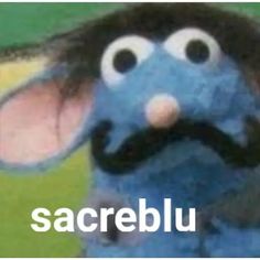 a blue stuffed animal with the words sacreblu on it's face