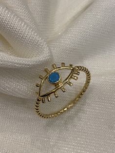 "ABOUT PRODUCT This 14K Gold Evil Eye Ring is beautifully designed and hand crafted with our associates to make this a special gift for your loved ones. Knowing the value of our customers, We prepare each piece with extra care and attention. ITEM DETAILS Material: 14K Gold Approx: 1.25 gram Available colors: Gold, Rose Gold, White Gold Available Sizes: 4 US to 11 US ✪ 14k Solid Gold ( Certification will be included with your order ) ✪Available 14K White, Yellow, Rose Gold (also in 10, 18K) 🛠 Ya Adjustable Blue 14k Gold Rings, Blue Stackable Midi Rings, Blue 14k Gold Stackable Rings As Gift, Blue Evil Eye Ring Jewelry, Yellow Gold Evil Eye Rings As Gifts, Evil Eye Rings As Gifts, Evil Eye Ring Jewelry Gift, Elegant Evil Eye Rings As Gift, Bohemian 14k Gold Ring As A Gift