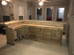 an unfinished kitchen counter in the middle of a room