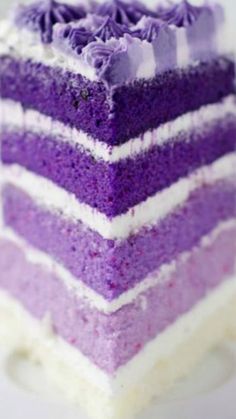 a slice of purple cake with white frosting