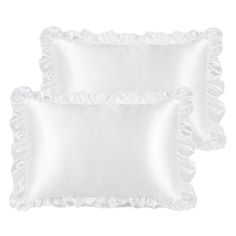 two white pillows with ruffled edges