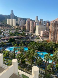 an aerial view of a city with palm trees