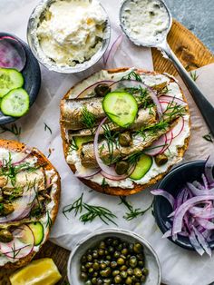 an assortment of food including bread, pickles and cucumbers