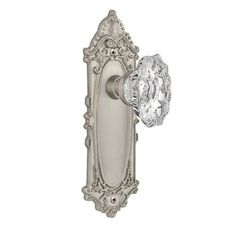 an antique style door handle with a crystal glass knob on the front and side of it