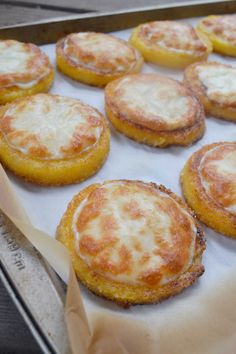 some food that is sitting on top of a pan with wax paper in front of it