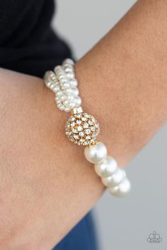 VINTAGE COLLISION - GOLD Featuring stretchy bands, a white rhinestone encrusted gold bead joins together strands of mismatched pearls and a single strand of classic white pearls around the wrist for a timeless twist. Sold as one individual bracelet. P9RE-GDXX-250XX ORDERED 17 JUL 20 Gold Pearl Bracelet, Rose Quartz Stone, Blue Gems, White Rhinestone, Stretchy Bracelets, Rhinestone Bracelet, Gold Pearl, Jewelry Party, Gold Beads