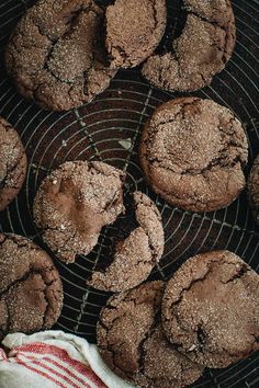 chocolate cookies are cooling on a wire rack