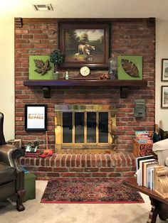 a living room filled with furniture and a fire place covered in pictures on the wall