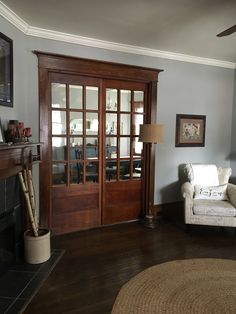 the living room is clean and ready to be used as a den or home office