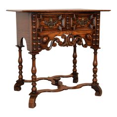 an old wooden table with ornate carvings on it