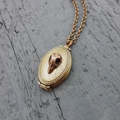 Antique Gold Locket Necklace In Brass, Handmade Antique Gold Brass Locket Necklace, Antique Finish Brass Round Pendant Locket Necklace, Gold Locket Necklace In Copper, Antique Gold Brass Pendant Locket Necklace, Bronze Copper Locket Jewelry, Vintage Bronze Round Pendant Locket Necklace, Handmade Brass Locket Necklace For Vintage Collection, Bronze Antique Locket Necklace