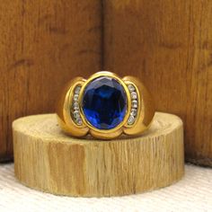 "Gold-tone sterling silver ring. The front is 5/8\" tall.  There are 5 clear faceted stones on each side of the center blue stone. Stamped China 925 LR. Ring size 8. Good condition. *The color on your screen may not reflect the actual stone color due to monitor variations.*" Formal Blue Sapphire Ring With Stone Setting, Anniversary Blue Sapphire Ring With Stone Setting, Black Onyx Ring, Tucson Az, Onyx Ring, Ring Fit, Amethyst Ring, Blue Stone, Tucson