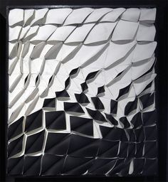 an abstract piece of art that looks like it has been made out of metal foil