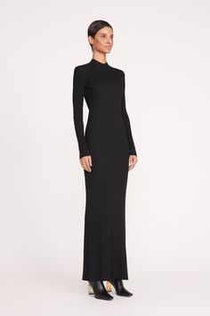 The Palmira Dress is our latest silhouette in our popular rib knit fabric; this style features a mock neck with a button closure and an open back. | STAUD, Palmira Dress in Black, Size Medium Rib Knit Fabric, A Button, Dress Black, Mock Neck, Open Back, Rib Knit, Black Color, Knit Fabric, Knitted Fabric