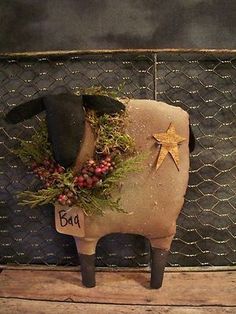 a sheep with a wreath on its back