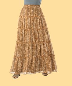 A must have skirt for every boho girl's wardrobe! Our lightweight, cheetah tiered maxi skirt features an elastic waist and tiered hemline. Pair it with sandals and a tee or dress it up with heels for a night out. Runs small- Please go up two size for comfort fitting. 40inch length full lined Hand-wash Flowy Maxi Dress With Ruffled Skirt For Beach, Beach Tiered Maxi Skirt With Ruffled Details, Beach Tiered Maxi Skirt, Beach Tiered Ruffled Maxi Skirt, Bohemian Brown Tiered Maxi Dress, Flowy Ankle-length Skirt For Vacation, Vacation Gathered Maxi Skirt, Flowy Ruffled Maxi Skirt For Vacation, Beach Tiered Ruffle Maxi Skirt