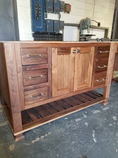 a large wooden cabinet sitting inside of a building