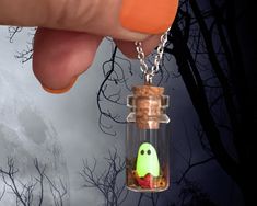 👻 Introducing our enchanting "Tiny Handcrafted Ghost in Bottle Necklace" - a bewitching accessory that captures the magic of the season!  🍂 Fall in love with this whimsical and delightful necklace that combines the charm of a miniature ghost with the beauty of autumn leaves. Handcrafted with love and attention to detail, this adorable glass bottle pendant is an absolute must-have for ghostly enthusiasts and nature lovers alike. 🌟Glow in the Dark Wonder: As the day turns to night, watch in won Cute Halloween Party Jewelry, Handmade Magical Jewelry For Halloween, Cute Handmade Halloween Jewelry, Whimsical Halloween Jewelry Gift, Ghost In Bottle, Dark Halloween Party, Ghost Bottle, Ghost In A Bottle, Pet Ghost