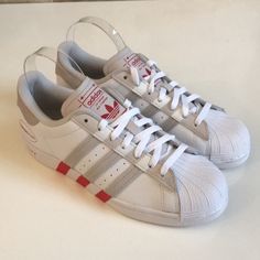 For 50 Years And Counting, People Have Been Smashing Barriers And Changing The Game In Their Shell-Toe Shoes. Lace Into These Adidas Superstar Shoes, Not Just To Celebrate The Legacy, But To Join It. All The Authentic Details Are Here, From The 3-Stripes To The Low Top Silhouette And The Rubber Toe Cap Everything That Made Them Legendary. All That's Left Is To Head Out And Make Your Own Mark. Color: Cloud White / Grey One / Vivid Red Size: Us 8 Condition: New Without Tags Or Box -- Unworn !! Lea Sporty Slip-on Skate Shoes With Red Sole, Adidas Custom Sneakers With Red Sole And Lace-up, Red Low-top Skate Shoes With Gum Sole, Red Adidas Low-top Custom Sneakers, Red Skate Shoes With Perforated Toe Box For Sports, Red Skate Shoes For Sports With Perforated Toe, Adidas Lace-up Sneakers With Red Sole, Casual Red Custom Adidas Sneakers, Custom Red Adidas Sneakers