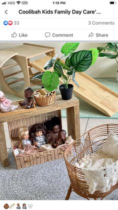 an image of dolls and toys in baskets on the floor next to a baby crib