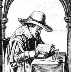 an old man sitting at a table writing