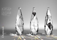 three crystal bottles sitting next to each other