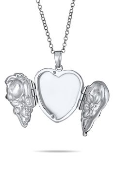 A beautiful gift, this detailed ladybug and flower embellished locket is designed in lustrous rhodium plated sterling silver for elegant style. 16" length + 2" extender; 1.15" x 0.94" pendant Adjustable clasp Rhodium plated sterling silver Imported Elegant Silver Locket Necklace As Gift For Mom, Silver Flower Shaped Jewelry For Mother's Day, Silver Jewelry With Flower Charm As Gift For Mom, Elegant Locket Jewelry As Gift For Mom, Silver Sterling Silver Locket Necklace With Charms, Silver Locket Necklace For Her, Sterling Silver Locket Necklace Gift For Mom, Silver Jewelry With Flower Charm For Mom, Flower Shape Jewelry As A Gift With Polished Finish