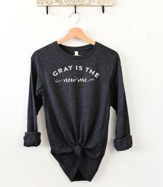 IMPORTANT HOLIDAY NOTE:  Orders placed after December 10th are NOT guaranteed to arrive by Christmas. We do our best to process and ship items quickly, but we can't guarantee against slower processing and shipping times after that time. Thank you! 🌟 Embrace Your Gray with Confidence! ️😍 Elevate your style with our trendy and empowering "Gray is the New Me" long sleeve t-shirt - specially designed for women gracefully transitioning to gray hair! 🌼✨ Made from premium quality fabric, this super Transitioning To Gray Hair, The New Me, The Dye, Shirt Hair, Going Gray, New Me, Gray Hair, The Gray, Favorite Shirts