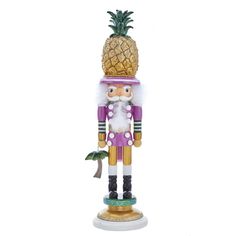 a nutcracker figurine with a pineapple on it's head