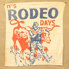 an old rodeo banner hanging on the wall with a cowboy riding a bull in front of it