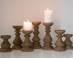 a group of wooden candles sitting next to each other