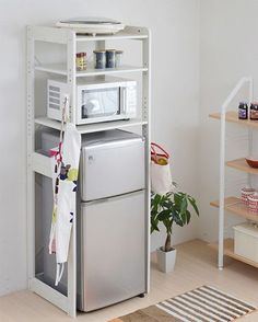 three different types of kitchen shelvings in various colors and sizes, including one with a microwave on top