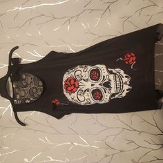 New Without Tags Sugar Skull Tank Top Never Worn Only Tried On Hanky Like Bottom Ties For Tank Top See Through Skull Back Please Comment For Measurements Or Any Questions Regarding Item Sizes Varry Based On Brand And Person Please Wash Before Wearing!!! Items Are Bag Kept. I Go Over Every Item Agin During Packing If I Find Anything Else Wrong With The Items I Will Message You Before Sending. Have A Little Grace I Am Only Human Black Tank Top For Halloween Festival, Emo Black Top For Festival, Gothic Sleeveless Top With Skull Print, Edgy Skull Print Tank Top For Halloween, Casual Halloween Skull Print Tank Top, Punk Style Skull Print Tops For Festival, Red Skull Print Top For Halloween, Casual Black Tank Top With Skull Print, Casual Black Skull Print Tank Top