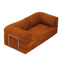 a large brown couch sitting on top of a white floor