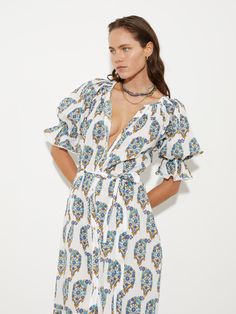 Théonie explores an old-world paisley wallpaper print across fresh white organic voile, ideal for tossing over swim. New style smock dress sitting below the knee. Button-through, ¾ sleeves with elastic sleeve cuff to create a full blouson sleeve. Wallpaper Print, Paisley Wallpaper, Blouson Sleeve, Beach Essentials, Resort Collection, Sleeve Cuff, Cotton Voile, Smock Dress, Resort Wear