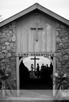 a black and white photo of people in front of a church with the words camp greenville written on it