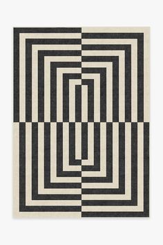 a black and white rug with squares in the middle