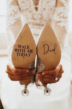 two brides holding up their wedding shoes with the words mr and mrs on them