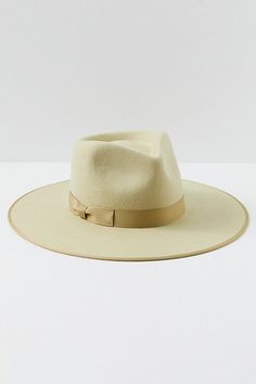 Top things off with this structured Australian wool hat featured in a round brim design with a ribbon on the crown. **Features:** Australian wool fabrication, round brim style, dipped crown, ribbon band, interior band for secure fit **Why We | Rancher Felt Hat by Lack of Color at Free People in Green, Size: M Beige Wool Fedora With Curved Brim, Beige Wool Fedora With Wide Brim, Beige Wool Wide Brim Fedora, Wool Wide Brim Hat For Kentucky Derby, Chic Brimmed Fur Felt Hat Band, Spring Brimmed Fur Felt Fedora, Wide Brim Wool Hat For Kentucky Derby, Wool Flat Brim Fedora For Spring, Beige Felt Hat With Flat Crown For Winter