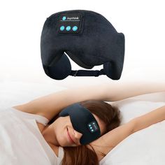 a woman laying in bed with a black eye mask on her face and the restor pillow above her head