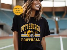 Show off your love and support for the Pittsburgh Steelers in this trendy, vintage style tee 🏈. This classic unisex Steelers jersey tee is sure to become your new favorite Steelers fan wear or the perfect gift for the Steelers fan in your life!  ✨ FIT & STYLE ✨ This classic unisex jersey short sleeve tee fits like a well-loved favorite. Soft cotton and quality print with ribbed knit collars. This runs true to size so size up for a more relaxed or oversized fit. .: 100% Airlume combed and ringsp Vintage Graphic T-shirt For Football Season, Vintage Graphic Print Football T-shirt, Vintage Graphic Print T-shirt For Football Season, Graphic Tee With Sports Lettering For Events, Graphic Tee With Lettering For Sports Events, Graphic Tee With Sports Lettering, Retro College Football Season T-shirt, Graphic Tee With Lettering For Game Day, Football Season Crew Neck T-shirt With Lettering